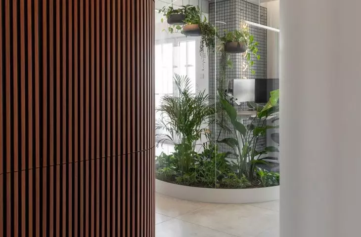 An apartment with a palm house in Warsaw, designed by AMJ Studio