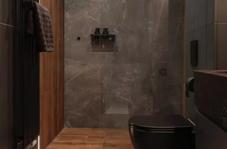The dark bathroom contrasts with the bright areas of the apartment