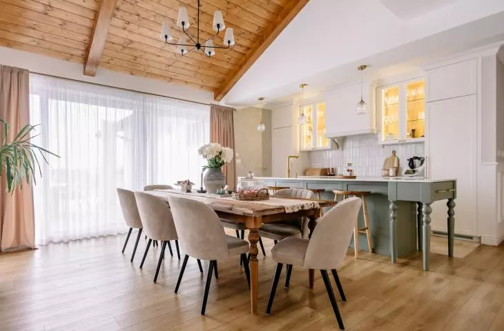 The kitchen and dining room are part of an open-concept living area that’s nearly 60 meters long
