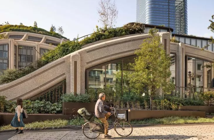 Greenery climbs up onto the roofs and terraces of the low-rise buildings in Azabudai Hills