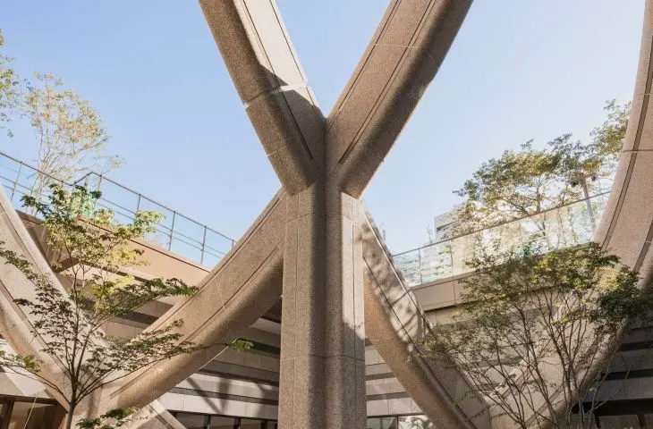 The steel structural grid organizes the building's layout while also creating distinctive arches and supports
