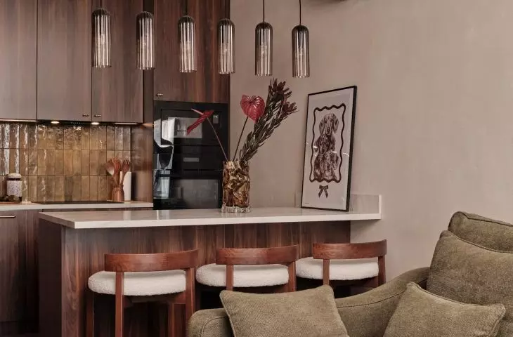 The peninsula has replaced the traditional dining table, connecting the kitchen to the living area