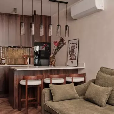 The peninsula has replaced the traditional dining table, connecting the kitchen to the living area