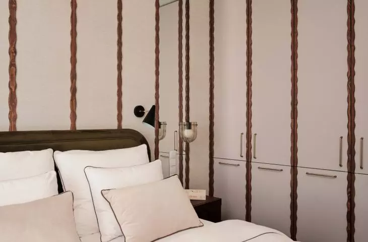Wall-to-wall cabinetry provides plenty of storage space in the bedroom