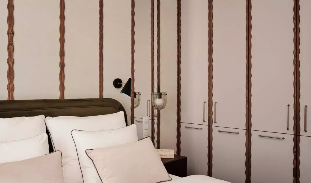 Wall-to-wall cabinetry provides plenty of storage space in the bedroom