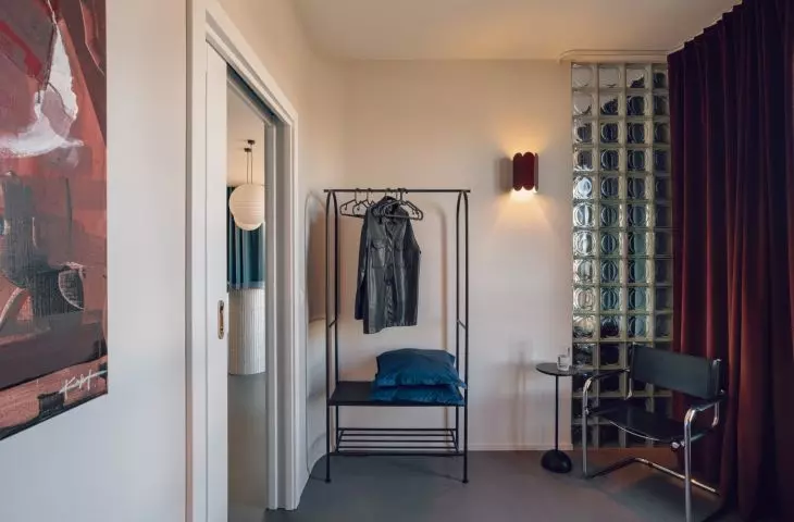 The glass blocks between the living area and the bedroom can be covered with a heavy curtain to provide guests with more privacy