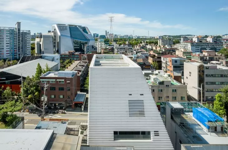 Hapjeong Artplex stands out with its compact, almost monolithic form