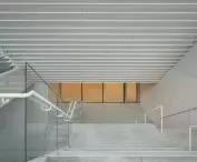 Stairs and landings lead through the building's various floors
