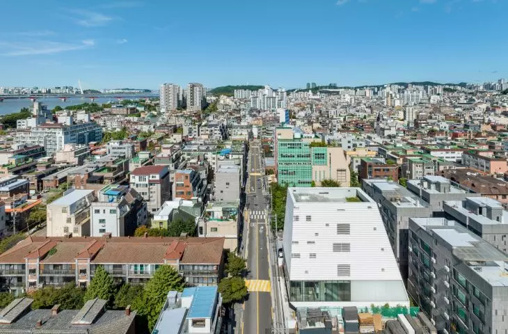 The building is situated within the densely built-up area of the Hapjeong-dong neighborhood