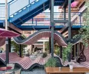 The undulating seats under the stairs create cozy spots to relax