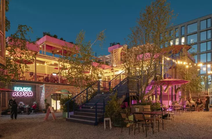 After dark, the lighting highlights the arrangement of terraces, stairs, and open areas
