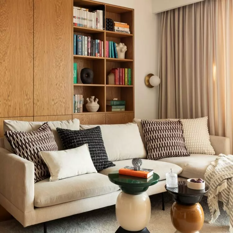 This wooden unit combines the functions of a bookshelf and a storage space