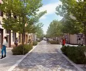 Poznańska Street after reconstruction (narrowing, stone pavement, new trees)