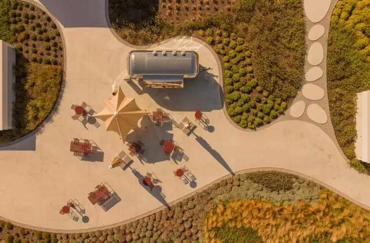 The green roof features, among other things, a dining area