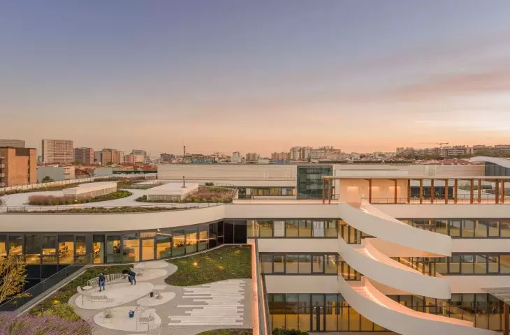 Terraces and winding ramps connect the various levels of the complex