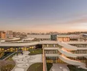 Terraces and winding ramps connect the various levels of the complex