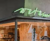 the café's green neon sign