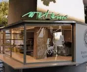 Even from a distance, the details catch your eye—the green neon sign with the café's name and the animal patterns on the windows