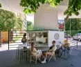 The café is located in the passageway between the two universities