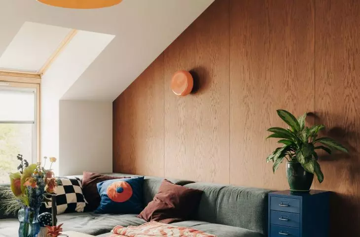 A sofa and a projector transform the attic into a private relaxation area
