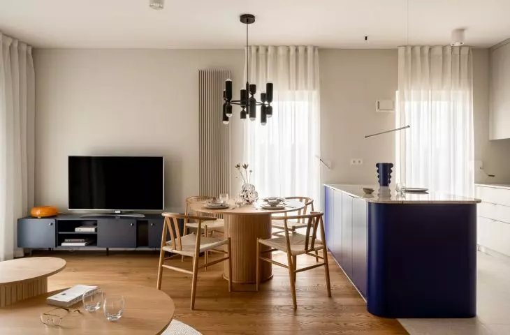 The cobalt-blue island is the focal point of the open living area
