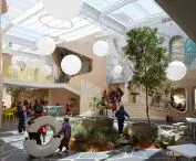 The glass roof transforms the central piazza into a bright space for gathering, learning, and having fun together