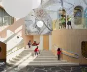 Wide staircases and landings are not just pathways—they also serve as places to rest, observe, and play