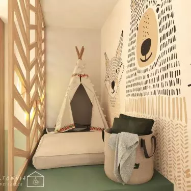 The openwork wooden structure creates a cozy nook for relaxation and play