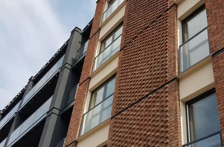 Careful ceramic finishing of the facade of an apartment building on Chwaliszewo Street, 2020, proj.: CDF Architects