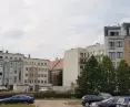 A view from the old bed of the Warta River (now a parking lot) to the fillings of the first decade of the 21st century on Garbary Street.
