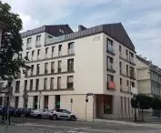 merely correct form of development additions on Dominikanska Street stands out from its surroundings in quality and character