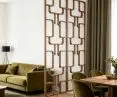 A Volak-style Nordic room divider in walnut, with an openwork panel in the living room