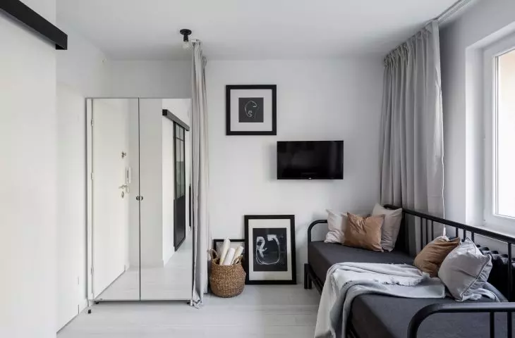 Part of the bedroom and living room