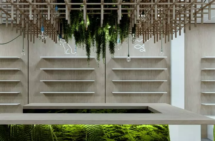 The wooden structure above the counter symbolizes an open cage