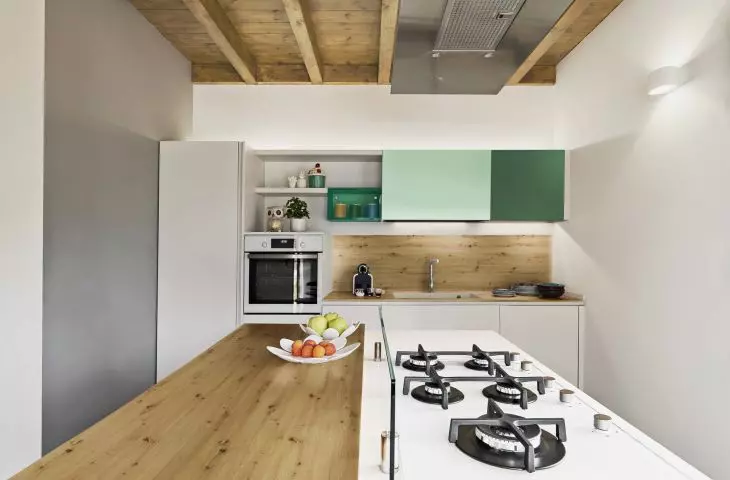 Wooden decor on the wall and as a kitchen countertop