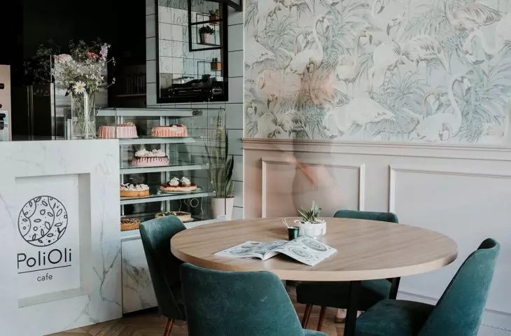 Green armchair upholstery coordinates with pink design elements