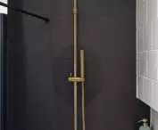 Gold and black bathroom
