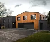 adjacent to the barn, the gray block house is intended for guests