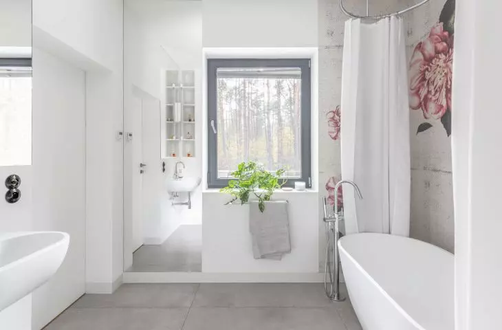 Light gray bathroom with floral element
