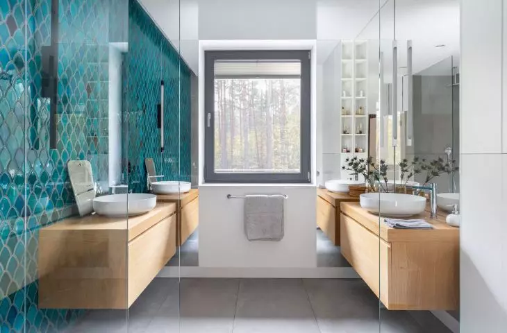 Bathroom with dark turquoise accents 