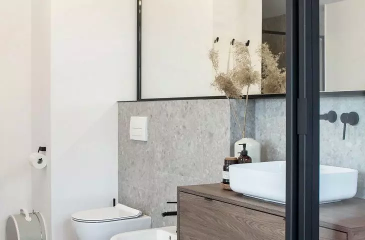 Large mirror over the sink and toilet