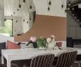 Living room wall with mural in terracotta color