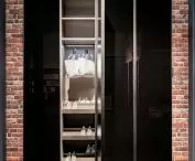 Dark glass doors match modern interior