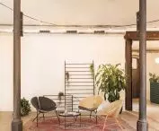 The rafters and cast iron columns are preserved in the space