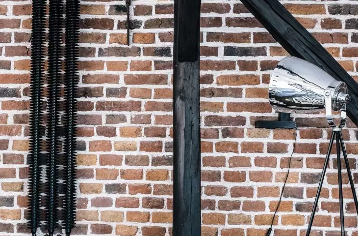 Brick wall and wooden rafters