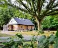 A forester's lodge under a centuries-old oak tree