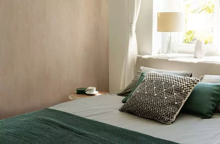 Wooden wall warms bedroom interior