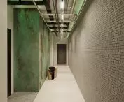 A corridor leading to each apartment