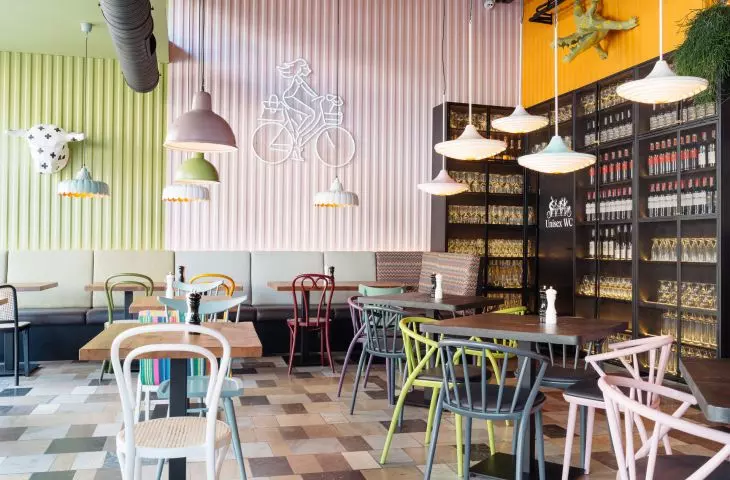 The colors of the chairs correspond with the colors of the walls