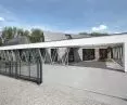 The triangles that appeared in the facade are a hidden sliding gate